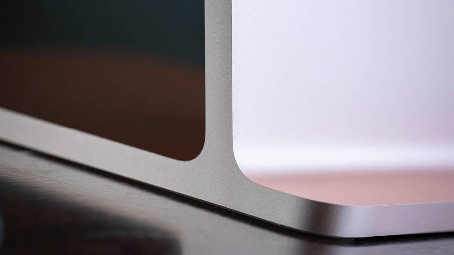 Close-up of the corner of a silver Apple iMac M4 2024, highlighting its sleek design.