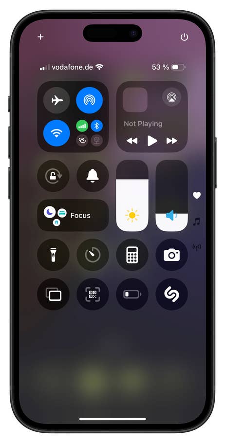 An iPhone 16 screen showing the Control Center with various icons and options.