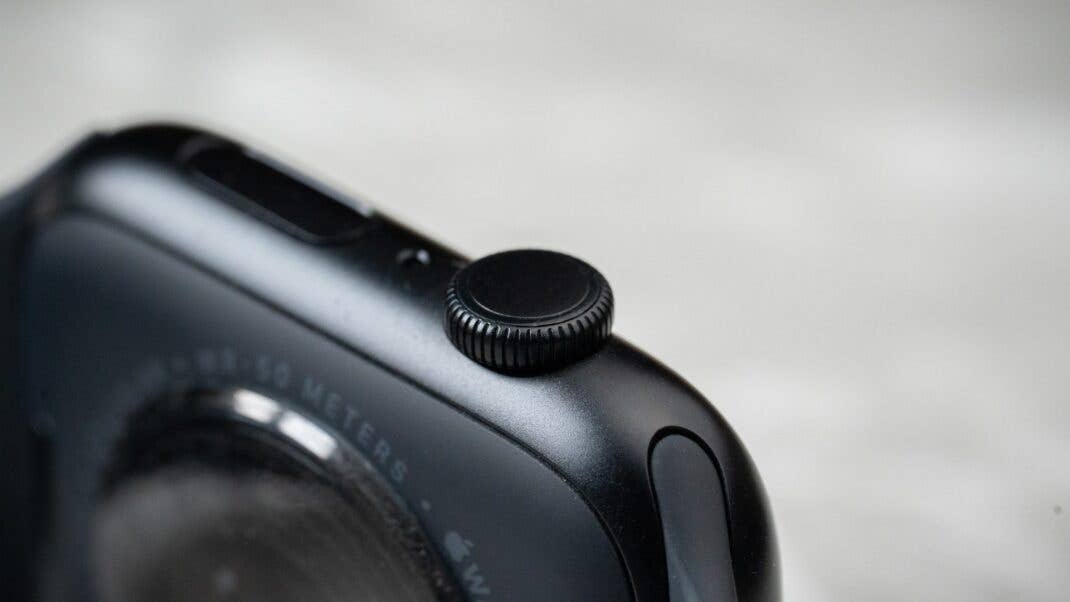 Close-up of the side of an Apple Watch SE 3 showing the digital crown and buttons.