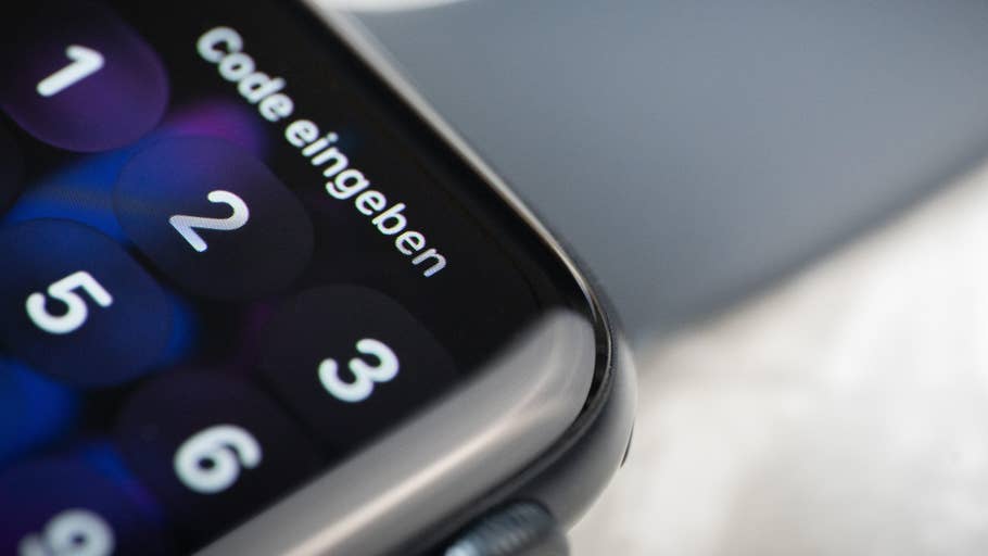 Close-up of an Apple Watch SE 3 displaying a passcode screen.