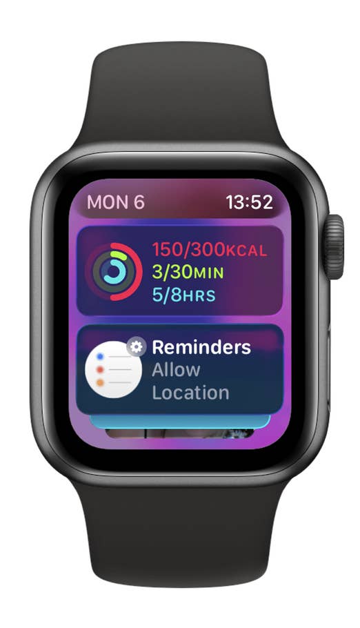 An Apple Watch SE 3 with a black band displays fitness data and reminders.