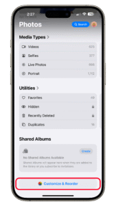 Scroll down to the bottom of the Photos app and then select Customize and Reorder. iPhone screen displaying the Photos app in iOS 18 with media types and shared albums.