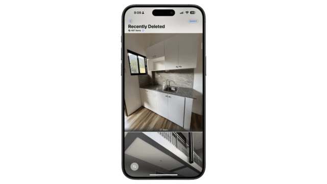 Select the photo or video you want to restore then long press on it to open menu. A phone displaying a photo gallery with a recently deleted kitchen image.