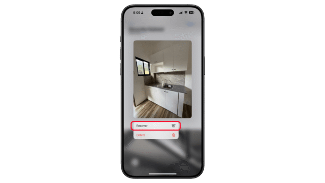Tap on the Restore button to restore a deleted photo or video. A smartphone screen displaying an image of a kitchen with options to recover or delete.