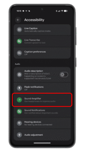 Scroll down and look for the Sound amplifier option. Android accessibility settings with options like Sound Amplifier and Live Caption.