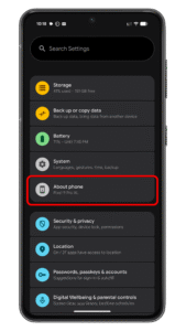 Tap on About phone to access the build number. Settings menu of an Android device displaying options like Storage, Battery, and About phone.