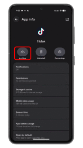 Tap on Archive to soft uninstall the app. A smartphone screen displaying the TikTok app info with options: Archive, Uninstall, and Force stop.