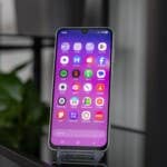 The Samsung Galaxy A26 is easily recognizable by its teardrop-shaped notch. Samsung Galaxy A26 smartphone displaying colorful app icons on the screen.