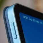 The button does not have a fingerprint sensor – instead, facial recognition is used to unlock the device. Close-up of Xiaomi Pad 7 with a blue frame and screen showing time and date.