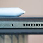 The speakers are Dolby Vision certified. However, they were less impressive in the review. Top view of a Xiaomi Pad 7 with a stylus and the Dolby Vision Atmos branding.