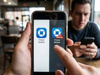 The Chase App Logo on a smartphone screen in a cafe.