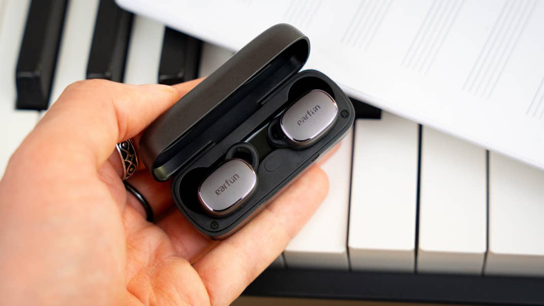 A button in the charging case helps you pair the earbuds.