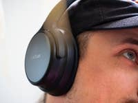 A close-up of a person wearing EarFun Tune Pro headphones.