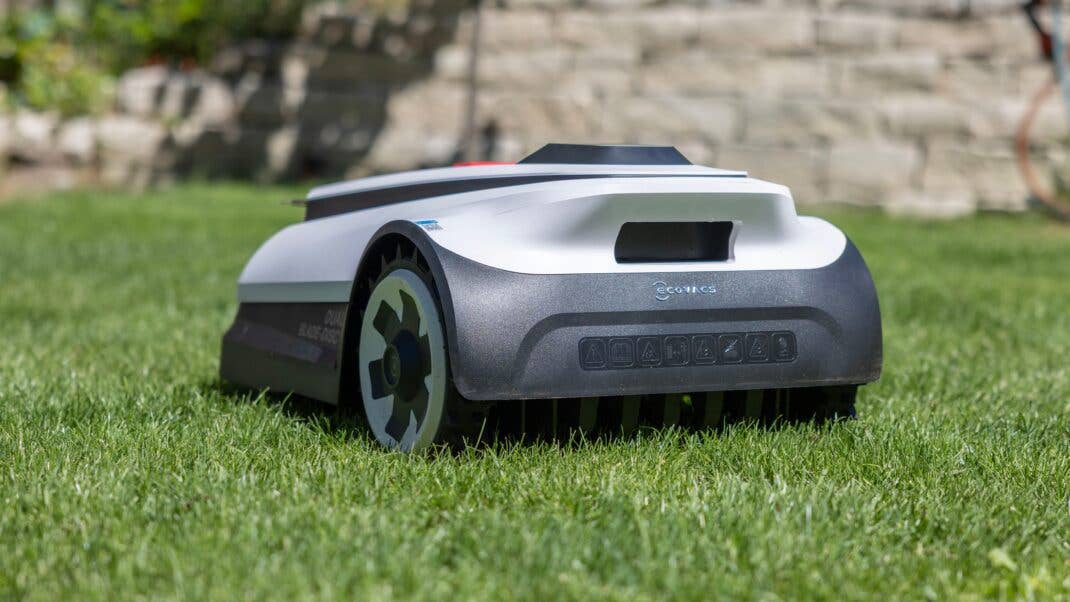 Ecovacs Goat A1600 RTK robotic lawn mower on green grass.