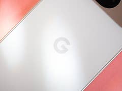Close-up of a Google Pixel 9 smartphone's back, featuring the logo on a white surface.