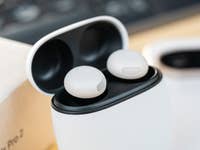 Google Pixel Buds Pro 2 inside their charging case, with a light background.