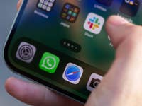 Apple iPhone 15 with the Safari and WhatsApp app icons