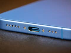 Close-up of an Apple iPhone 16 showing the USB-C charging port.