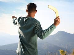 Man holding a boomerang