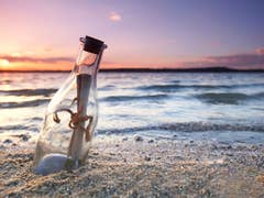 Message in a bottle at the sea