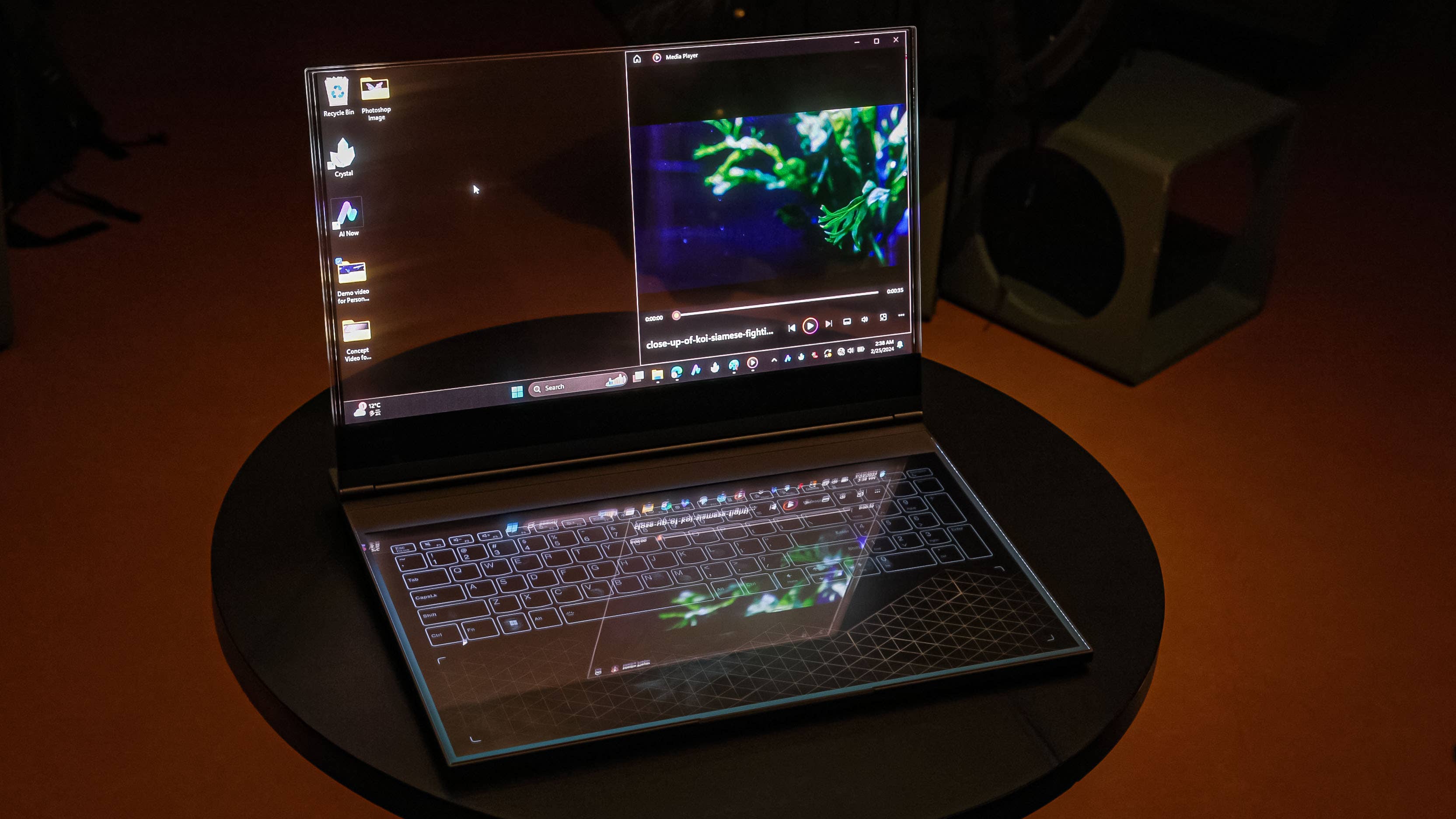 Lenovo Transparent screen notebook with a visible desk surface behind the display