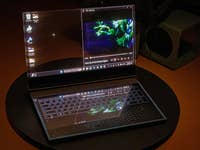 Lenovo Transparent screen notebook with a visible desk surface behind the display
