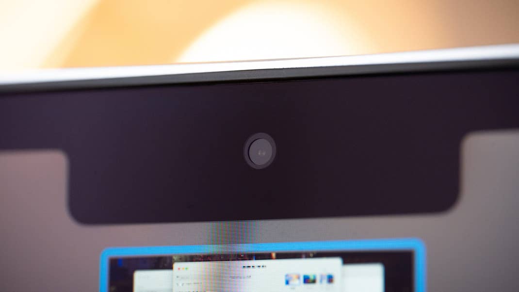 Close-up of a MacBook Air M4 webcam with a blurred screen background. Close-up of a MacBook Air M4 webcam with a blurred screen background.