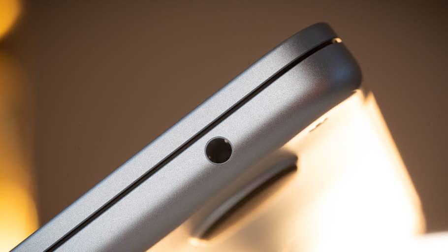 Close-up of the side of an Apple MacBook Air M4 showing the 3.5mm headphone jack.