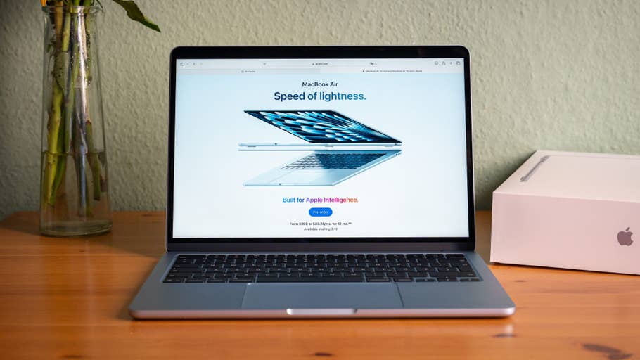 Apple MacBook Air with the u0027Speed ​​of lightnessu0027 motto, sporting a sleek design on a wooden table.