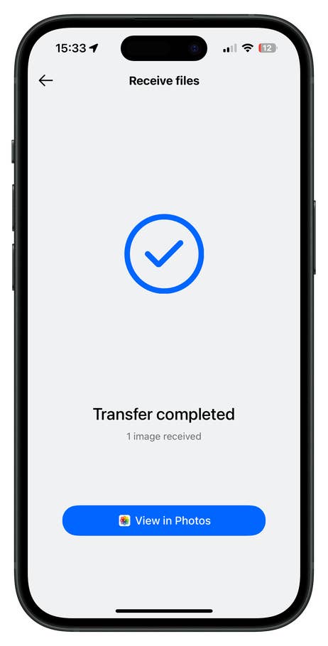 OnePlus smartphone screen displaying u0027Receive filesu0027 and u0027Transfer completedu0027 message.