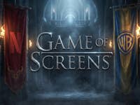A large lettering: Game of Screens, but in Game of Thrones font. On the left hangs a Netflix flag, on the right one from Warner.