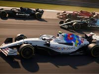 Several racing cars duel on the track, the car with the Gemini logo is in the lead.