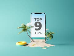 A smartphone in a beach scenario with a "Top 9 Tips" sentence on the display