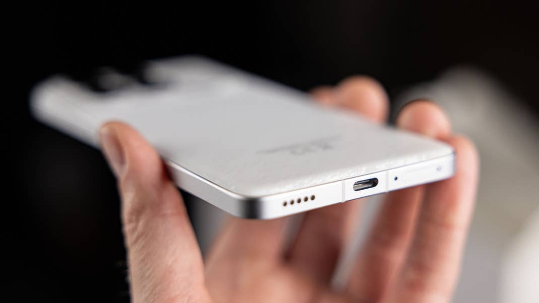 Bottom face of the Poco F6 Pro showing the speaker grille and USB-C port.