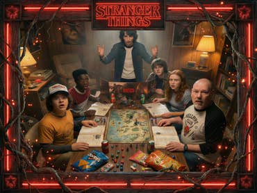 The Stranger Things heroes sit together with a man in the basement and play Dungeons and Dragons.