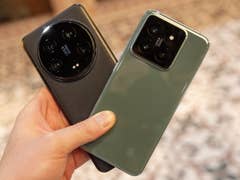 Xiaomi 14 Ultra (left) and Xiaomi 14 held in hand