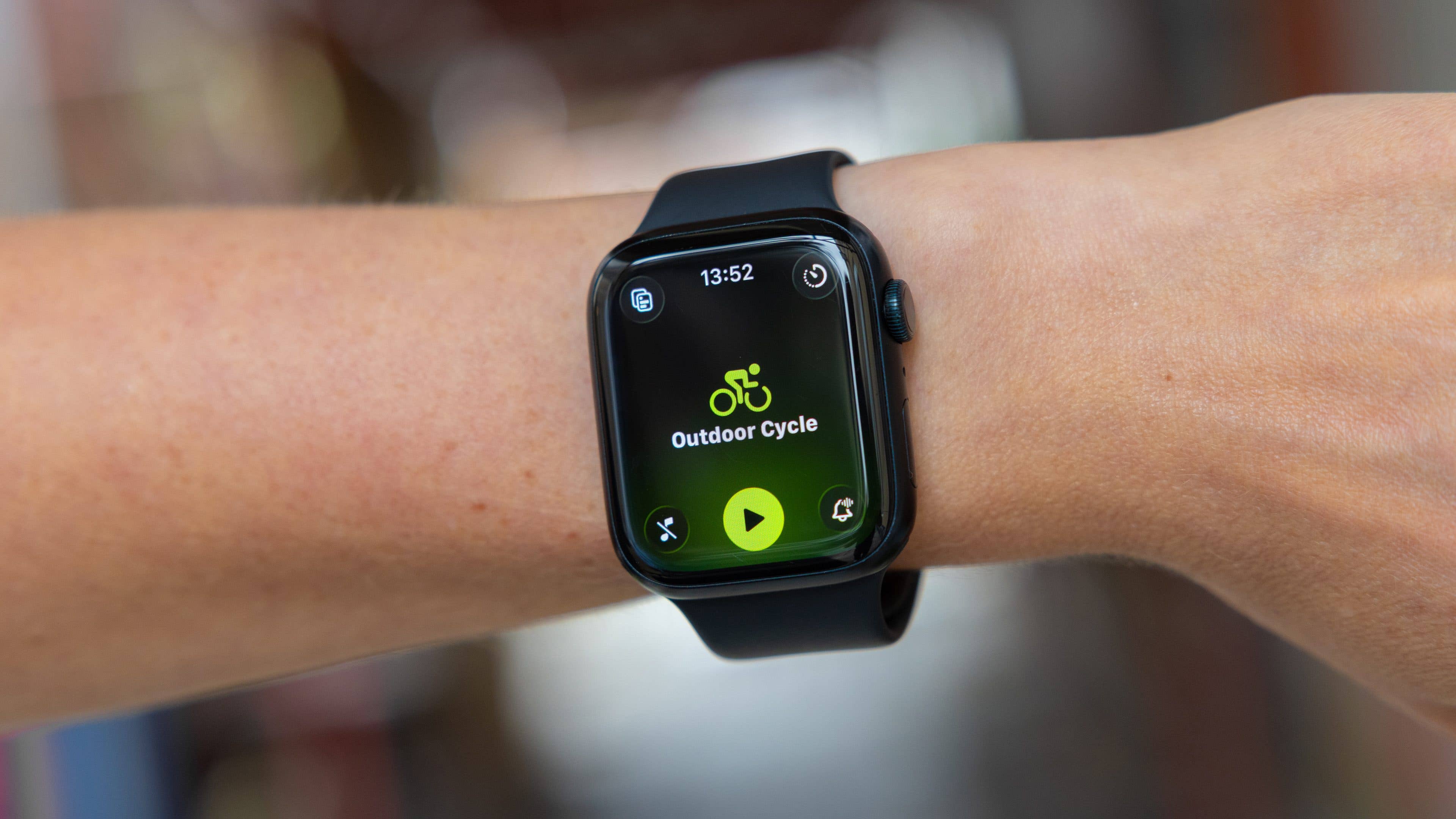 A smartwatch displaying the 'Outdoor Cycle' workout app in watchOS-26.