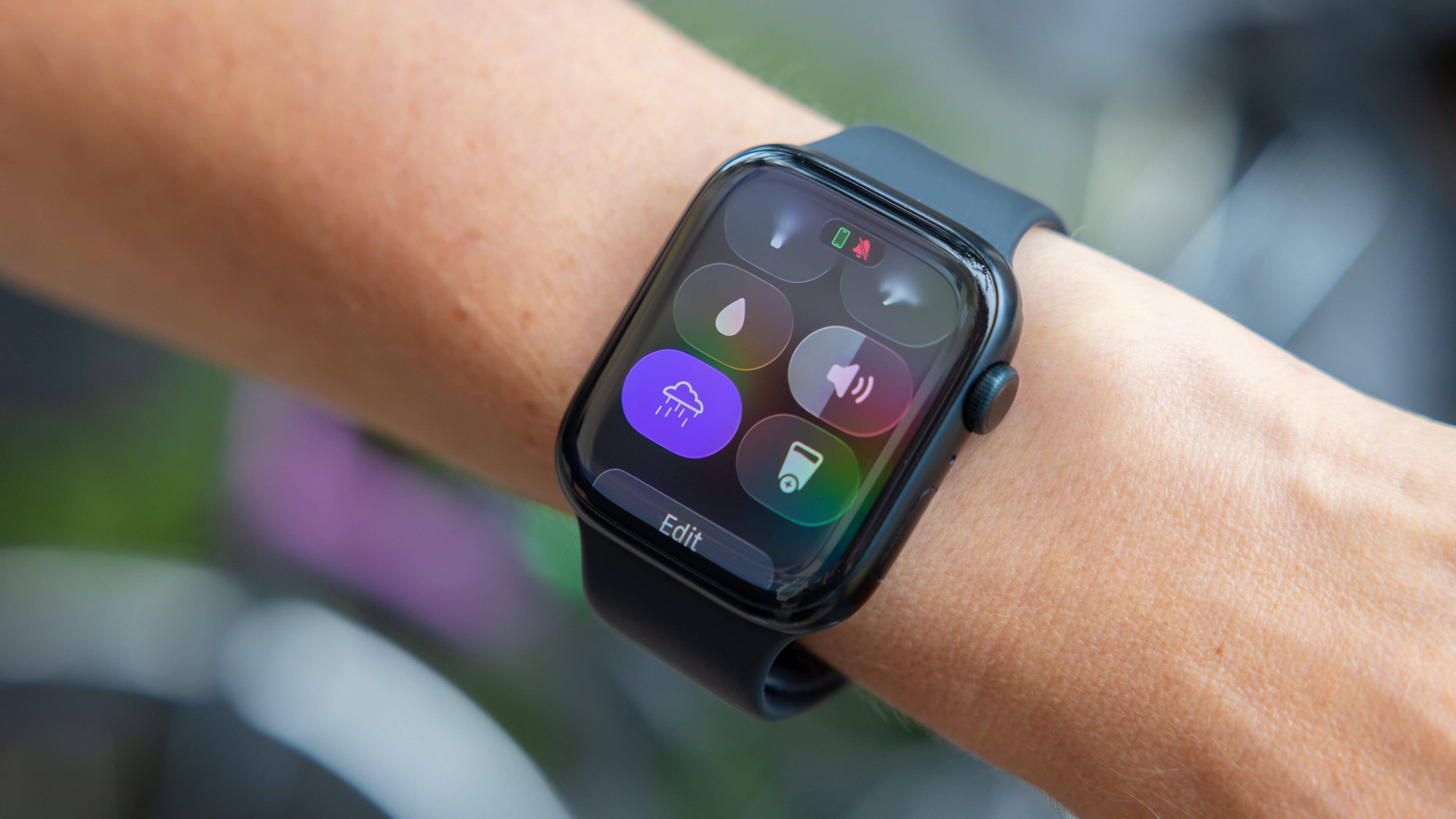 A close-up of a smartwatch displaying various controls on the screen.
