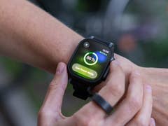 A close-up of an Apple Watch displaying a battery level of 86% and a low power mode notification.