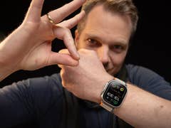 A person shows off the Apple Watch Ultra 2 on their wrist, displaying the watch face with the time 12:38.