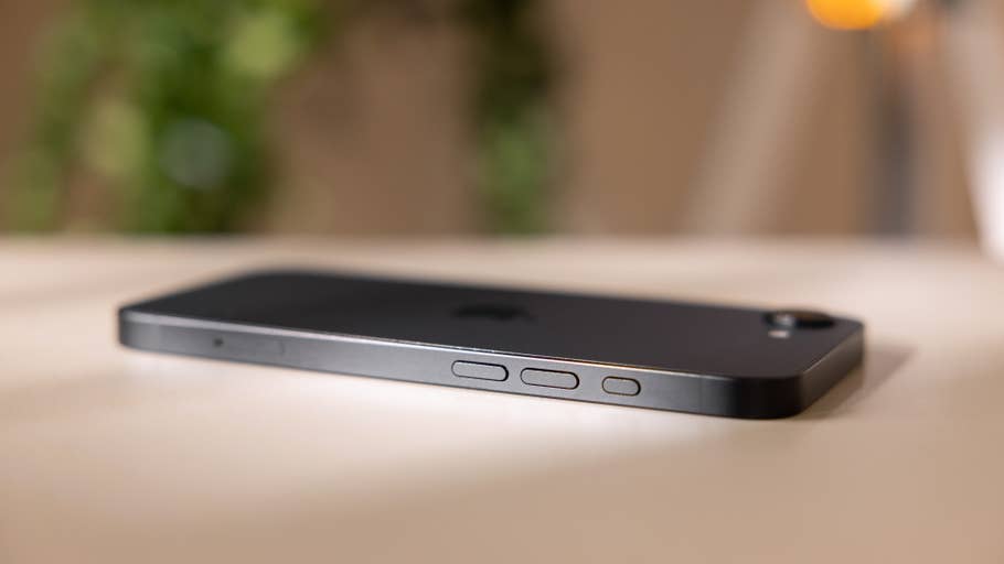 A close-up of the side of an Apple iPhone 16e, showcasing buttons and sleek design.