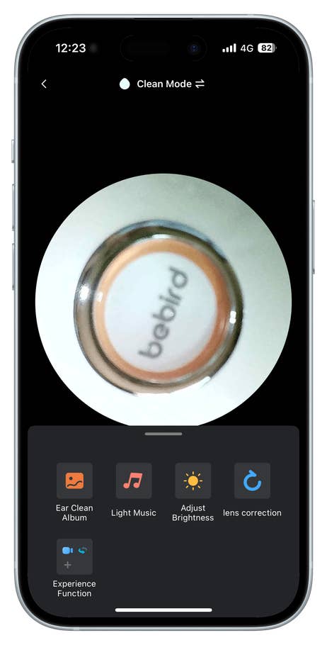 Close-up of a Bebird device interface showing options like u0027Ear Clean Albumu0027 and u0027Adjust Brightnessu0027.