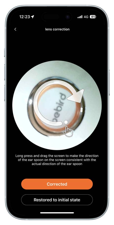 Lens correction interface showing instructions for aligning an ear spoon.