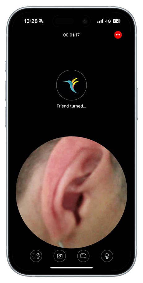 A phone screen displaying a video call with an image of an ear and a u0027Friend turned...u0027 message.