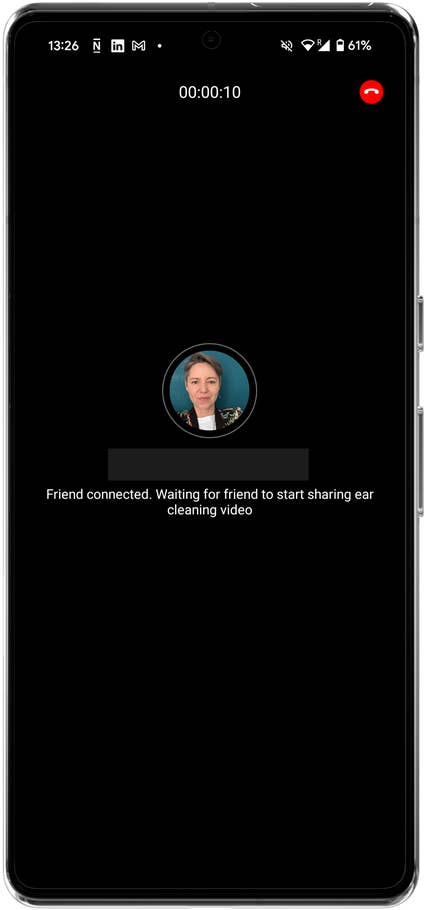 Video call interface with a user connected, waiting for a friend to share an ear cleaning video.