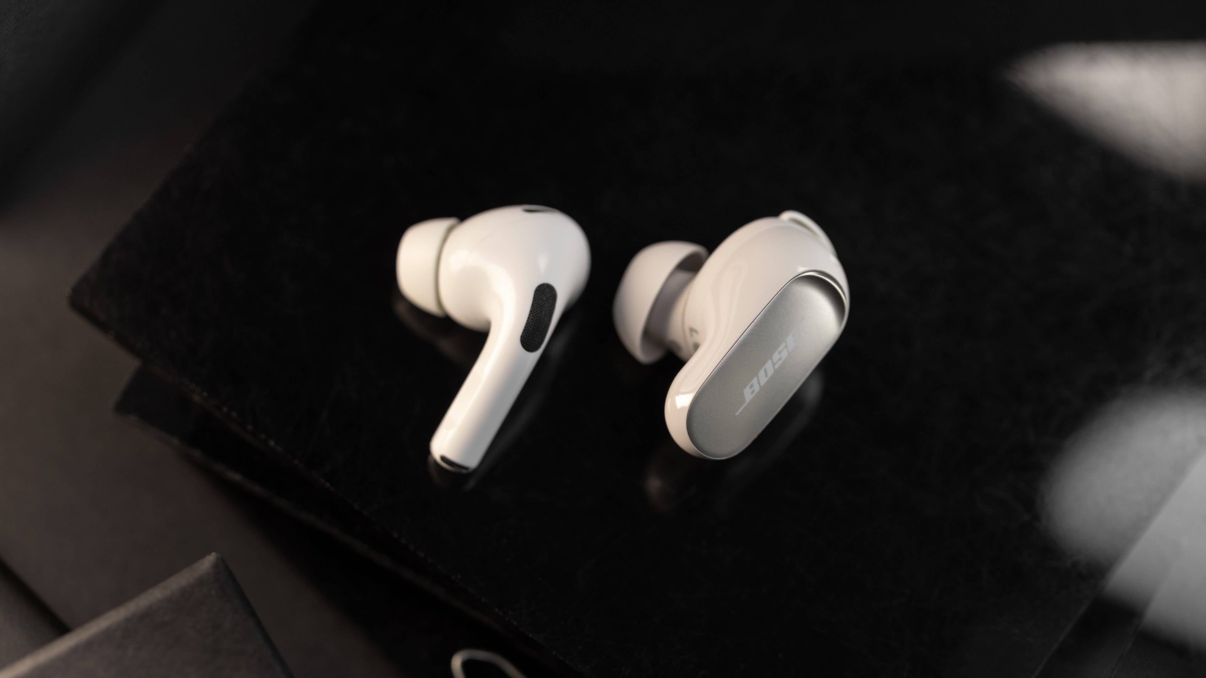 This is what the Bose QuietComfort Ultra Earbuds look like next to an AirPods Pro 2.