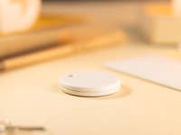 Chipolo One Point and Card Point item trackers next to each other.