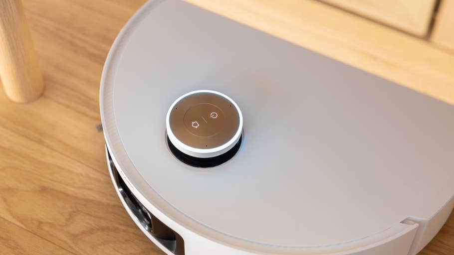 A top view of a Dreame X50 Ultra robot vacuum cleaner with its controls.
