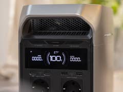 EcoFlow Delta 3 Plus portable power station with display showing 100% battery and various output/input details.