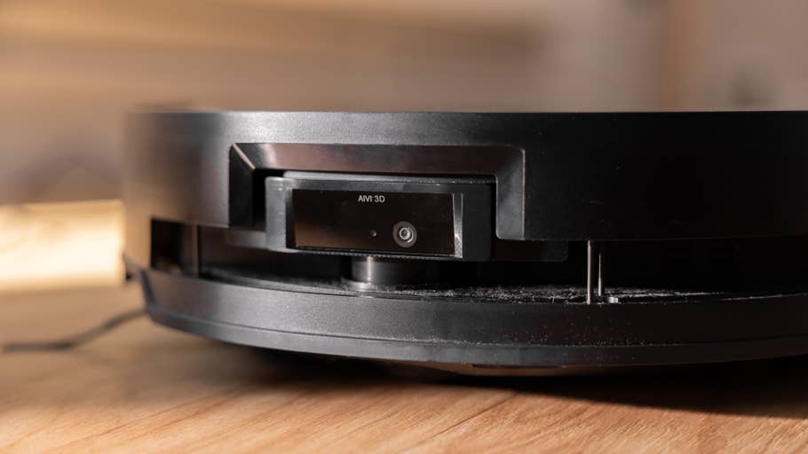 Close-up of a black Ecovacs Deebot X8 Pro Omni robot vacuum cleaner.